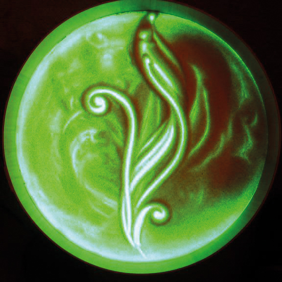 Foto: Bild aus Gries auf grün beleuchteter Leuchttonne